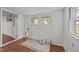 Utility room with two windows, wainscoting, and space for a washer and dryer at 303 N Watauga Ave, Dunn, NC 28334