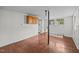 Utility room with unfinished flooring and wainscoting, with space for appliances at 303 N Watauga Ave, Dunn, NC 28334