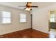 Bedroom with hardwood flooring, ceiling fan, and natural light at 325 Northfield Dr, Raleigh, NC 27609