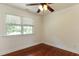 Bedroom with hardwood floors, ceiling fan, and bright natural light at 325 Northfield Dr, Raleigh, NC 27609
