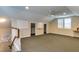 Spacious bonus room with neutral carpet, whiteboard, and ceiling fan, perfect for recreation and hobbies at 325 Northfield Dr, Raleigh, NC 27609