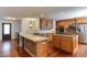 Spacious kitchen with granite countertops, custom cabinetry, and stainless steel appliances at 325 Northfield Dr, Raleigh, NC 27609