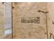Tiled shower featuring a built in shelf and glass door at 325 Northfield Dr, Raleigh, NC 27609