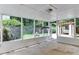 Screened-in porch with views of the landscaped backyard, outdoor fireplace and a pergola covered patio at 325 Northfield Dr, Raleigh, NC 27609