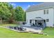 Large backyard with deck, gazebo, patio area with seating, and well-maintained lawn at 3713 Highland Creek Dr, Apex, NC 27539