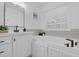 Bathroom with vanity and quartz countertop, undermount sink, soaking tub, and window at 3713 Highland Creek Dr, Apex, NC 27539