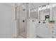 Modern bathroom features a glass enclosed shower and double vanity with matte black hardware at 3713 Highland Creek Dr, Apex, NC 27539