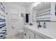 Bright bathroom featuring a white vanity, sleek black faucet, and modern mirror at 3713 Highland Creek Dr, Apex, NC 27539