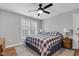 Bedroom featuring a ceiling fan, comfortable bed, and hardwood floors at 3713 Highland Creek Dr, Apex, NC 27539