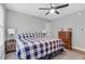 Bedroom featuring a ceiling fan, comfortable bed, and hardwood floors at 3713 Highland Creek Dr, Apex, NC 27539