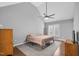 Neutral primary bedroom features vaulted ceilings, a ceiling fan and hardwood floors at 3713 Highland Creek Dr, Apex, NC 27539