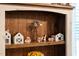 Close-up of wooden shelves showcasing charming farmhouse-style decorations at 3713 Highland Creek Dr, Apex, NC 27539