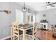 Cozy dining area with wood floors, a stylish ceiling fan, and bright natural light at 3713 Highland Creek Dr, Apex, NC 27539
