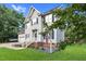 Charming two-story home featuring blue shutters, an attached garage, front yard, and manicured landscaping at 3713 Highland Creek Dr, Apex, NC 27539