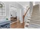 Inviting foyer with hardwood floors leads to the dining room and staircase at 3713 Highland Creek Dr, Apex, NC 27539