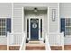Close-up of the front door featuring a decorative wreath, the house number and a decorative welcome sign at 3713 Highland Creek Dr, Apex, NC 27539