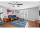 A workout area including a treadmill, exercise bike, ceiling fan, and futon at 3713 Highland Creek Dr, Apex, NC 27539