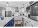 Well-appointed kitchen featuring stainless steel appliances, white cabinets, and subway tile backsplash at 3713 Highland Creek Dr, Apex, NC 27539