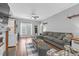 Stylish living room featuring a comfortable sofa, a decorative ladder, and ample natural light at 3713 Highland Creek Dr, Apex, NC 27539