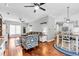 Spacious living area blending a cozy lounge with a well-lit kitchen and dining space at 3713 Highland Creek Dr, Apex, NC 27539
