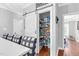 Bright pantry with shelving, barn door, and a variety of storage options for food and supplies at 3713 Highland Creek Dr, Apex, NC 27539