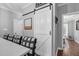 Charming kitchen with a white sliding barn door leading to a well-organized pantry at 3713 Highland Creek Dr, Apex, NC 27539