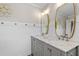 Bathroom features double vanity with marble countertops and decorative mirrors at 425 Hidden Cellars Dr, Holly Springs, NC 27540