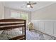 The bedroom features bunkbeds and a decorative area rug on a wooden floor at 425 Hidden Cellars Dr, Holly Springs, NC 27540