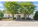 This clubhouse features two trees in front and manicured plants at 425 Hidden Cellars Dr, Holly Springs, NC 27540