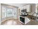 Bright eat-in kitchen nook with bay window and stainless steel appliances at 425 Hidden Cellars Dr, Holly Springs, NC 27540