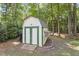 The backyard has a small storage shed, with green trim at 425 Hidden Cellars Dr, Holly Springs, NC 27540