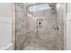 Modern glass enclosed shower with decorative tile and built-in soap niche at 425 Hidden Cellars Dr, Holly Springs, NC 27540