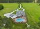 Lovely aerial view of a backyard featuring a pool, patio, and lush landscaping, perfect for outdoor enjoyment at 4737 Uzzle Rd, Rougemont, NC 27572