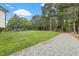 Expansive backyard with mature trees, meticulously kept landscaping and pool at 4737 Uzzle Rd, Rougemont, NC 27572