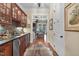 Entertainer's bar area with wood cabinetry, stone backsplash, and stainless steel appliances at 4737 Uzzle Rd, Rougemont, NC 27572
