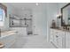 Expansive bathroom featuring a glass enclosed shower, standalone tub and large vanity at 4737 Uzzle Rd, Rougemont, NC 27572