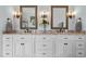 Bathroom vanity with dual sinks, granite countertops, and decorative lighting fixtures at 4737 Uzzle Rd, Rougemont, NC 27572