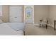 Bedroom with a sitting area and a walk-in closet with a window for natural lighting at 4737 Uzzle Rd, Rougemont, NC 27572