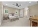 Spacious bedroom featuring neutral color walls and carpet with a fan and ample natural light at 4737 Uzzle Rd, Rougemont, NC 27572
