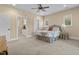 Spacious bedroom with two windows, a ceiling fan, and an attached bathroom at 4737 Uzzle Rd, Rougemont, NC 27572