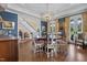 Dining area with round table, patterned chairs, and an elegant chandelier at 4737 Uzzle Rd, Rougemont, NC 27572
