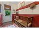 Charming entryway with a wooden bench, decorative hooks, and a view of the outdoors at 4737 Uzzle Rd, Rougemont, NC 27572