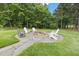 Backyard fire pit and seating area offering the perfect spot for relaxation and outdoor gatherings at 4737 Uzzle Rd, Rougemont, NC 27572