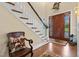 Foyer with staircase, hardwood floors, and a wooden front door at 4737 Uzzle Rd, Rougemont, NC 27572
