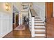 Inviting foyer with hardwood floors, staircase, and a view of the living spaces at 4737 Uzzle Rd, Rougemont, NC 27572