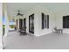 Spacious covered front porch with ample seating and scenic views at 4737 Uzzle Rd, Rougemont, NC 27572