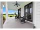 Relaxing covered front porch with rocking chairs and scenic outdoor views at 4737 Uzzle Rd, Rougemont, NC 27572
