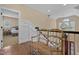 Hallway with a bench, hardwood floors, and stairs leading to the next level at 4737 Uzzle Rd, Rougemont, NC 27572