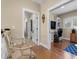 Hallway with hardwood floors and views of the office and bathroom at 4737 Uzzle Rd, Rougemont, NC 27572