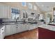 Spacious kitchen with custom cabinets, large island, and stainless steel appliances at 4737 Uzzle Rd, Rougemont, NC 27572